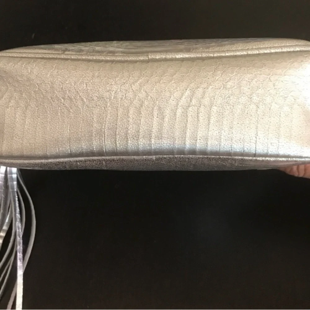 Victoria’s Secret silver snake skin purse with gold chain strap.